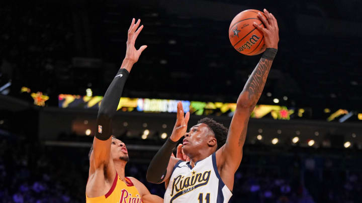 Feb 16, 2024; Indianapolis, Indiana, USA; Team Detlef forward Tyler Smith (11) of the G League Ignite shoots the ball against Team Pau center Victor Wembanyama (1) of the San Antonio Spurs during a Rising Stars semifinal game at Gainbridge Fieldhouse. Mandatory Credit: Kyle Terada-USA TODAY Sports Feb 16, 2024; Indianapolis, Indiana, USA; Team Detlef forward Tyler Smith (11) of the G League Ignite shoots the ball against Team Pau center Victor Wembanyama (1) of the San Antonio Spurs during a Rising Stars semifinal game at Gainbridge Fieldhouse. Mandatory Credit: Kyle Terada-USA TODAY Sports