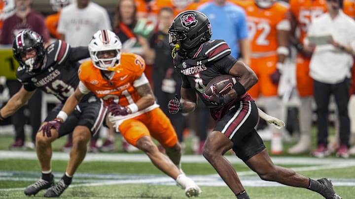 Aug 31, 2025; Atlanta, Georgia, USA; South Carolina Gamecocks defensive back Vicari Swain (4) returns a punt for a touchdown against the Virginia Tech Hokies during the second half at Mercedes-Benz Stadium. Mandatory Credit: Dale Zanine-Imagn Images