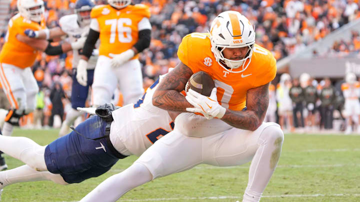 Nov 23, 2024; Knoxville, Tennessee, USA; Tennessee Volunteers tight end Ethan Davis (0) carries the ball against the UTEP Miners during the first half at Neyland Stadium. Mandatory Credit: Angelina Alcantar/USA TODAY Network via Imagn Images