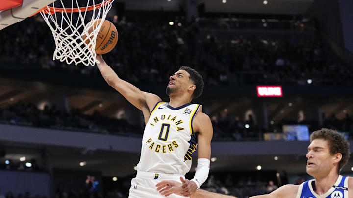 Mar 15, 2025; Milwaukee, Wisconsin, USA;  Indiana Pacers guard Tyrese Haliburton (0) drives for a dunk during the second quarter against the Milwaukee Bucks at Fiserv Forum. Mandatory Credit: Jeff Hanisch-Imagn Images