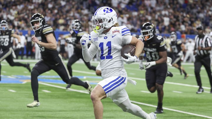 Dec 28, 2024; San Antonio, TX, USA; Brigham Young Cougars wide receiver Parker Kingston (11) returns a punt for a touchdown during the second quarter against the Colorado Buffaloes at Alamodome. Mandatory Credit: Troy Taormina-Imagn Images