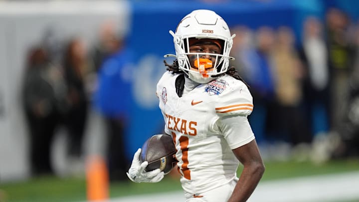 Jan 1, 2025; Atlanta, GA, USA; Texas Longhorns wide receiver Silas Bolden (11) returns a punt for a touchdown against the Arizona State Sun Devils during the first half of the Peach Bowl at Mercedes-Benz Stadium.