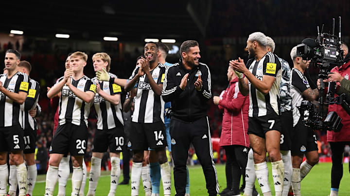 Newcastle United players celebrate at Old Trafford on Monday night