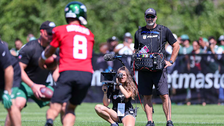 Jul 22, 2023; Florham Park, NJ, USA;  An NFL Films crew  for the HBO television series Hard Knocks films as New York Jets quarterback Aaron Rodgers (8) participates in drills during the New York Jets Training Camp at Atlantic Health Jets Training Center.