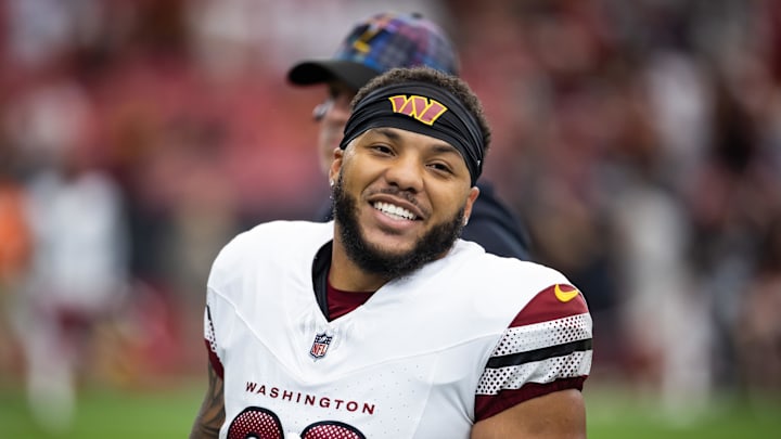 Sep 29, 2024; Glendale, Arizona, USA; Washington Commanders running back Chris Rodriguez Jr. (23) against the Arizona Cardinals at State Farm Stadium. Mandatory Credit: Mark J. Rebilas-Imagn Images