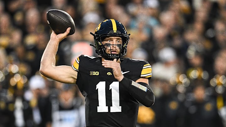 Oct 18, 2025; Iowa City, Iowa, USA; Iowa Hawkeyes quarterback Mark Gronowski (11) throws a pass against the Penn State Nittany Lions during the first quarter at Kinnick Stadium. Mandatory Credit: Jeffrey Becker-Imagn Images Oct 18, 2025; Iowa City, Iowa, USA; Iowa Hawkeyes quarterback Mark Gronowski (11) throws a pass against the Penn State Nittany Lions during the first quarter at Kinnick Stadium. Mandatory Credit: Jeffrey Becker-Imagn Images