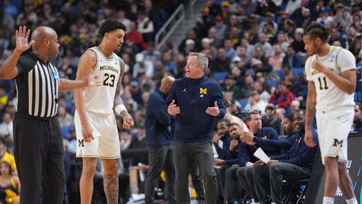 Mar 21, 2026; Buffalo, NY, USA; Michigan Wolverines head coach Dusty May speaks with forward Yaxel Lendeborg (23) in the second half against the Saint Louis Billikens during a second round game of the men's 2026 NCAA Tournament at Keybank Center. Mandatory Credit: Gregory Fisher-Imagn Images Mar 21, 2026; Buffalo, NY, USA; Michigan Wolverines head coach Dusty May speaks with forward Yaxel Lendeborg (23) in the second half against the Saint Louis Billikens during a second round game of the men's 2026 NCAA Tournament at Keybank Center. Mandatory Credit: Gregory Fisher-Imagn Images