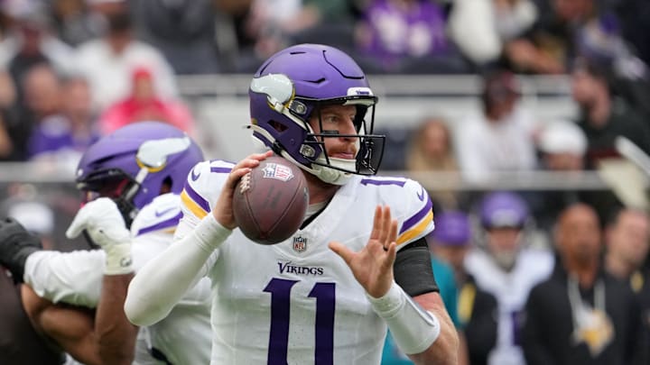 Oct 5, 2025; Tottenham, United Kingdom; Minnesota Vikings quarterback Carson Wentz (11) looks to pass the ball against the Cleveland Browns during the third quarter of an NFL International Series game at Tottenham Hotspur Stadium. Mandatory Credit: Kirby Lee-Imagn Images