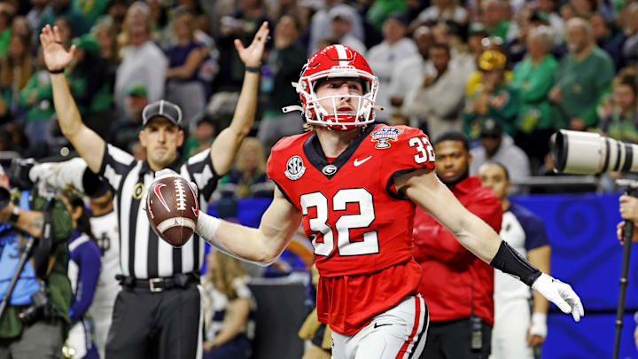 Jan 2, 2025; New Orleans, LA, USA; Georgia Bulldogs running back Cash Jones (32) celebrates after scoring a touchdown during the second half against the Notre Dame Fighting Irish at Caesars Superdome. Mandatory Credit: Amber Searls-Imagn Images