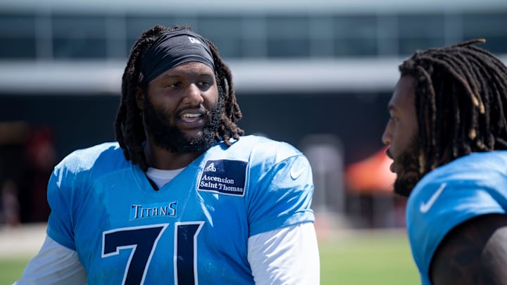Tennessee Titans offensive tackle Jaelyn Duncan (71) and offensive tackle JC Latham (55) talk after practice during training camp at Ascension Saint Thomas Sports Park in Nashville, Tenn., Wednesday, Aug. 21 2024. Tennessee Titans offensive tackle Jaelyn Duncan (71) and offensive tackle JC Latham (55) talk after practice during training camp at Ascension Saint Thomas Sports Park in Nashville, Tenn., Wednesday, Aug. 21 2024.