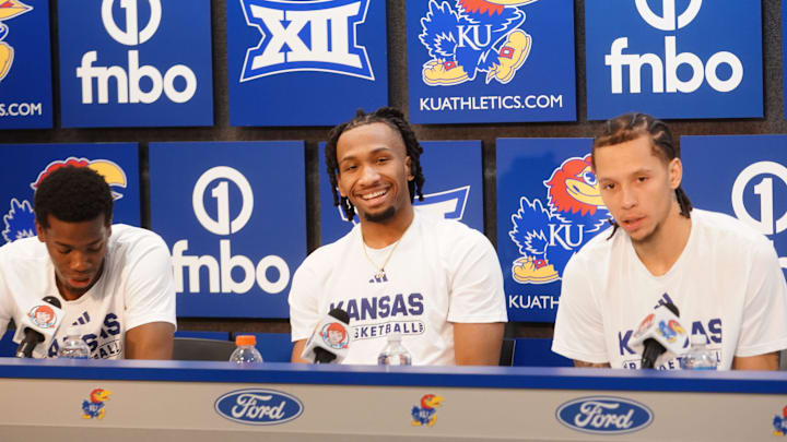 Kansas Jayhawks guard Melvin Council Jr. (14), Kansas Jayhawks guard Darryn Peterson (22) and Kansas Jayhawks guard Tre White (3) 