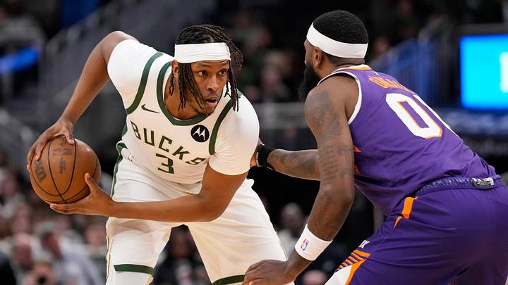 Mar 10, 2026; Milwaukee, Wisconsin, USA; Milwaukee Bucks center Myles Turner (3) holds the ball away from Phoenix Suns forward Royce O’Neal (00) during the first quarter at Fiserv Forum. Mandatory Credit: Jeff Hanisch-Imagn Images Mar 10, 2026; Milwaukee, Wisconsin, USA; Milwaukee Bucks center Myles Turner (3) holds the ball away from Phoenix Suns forward Royce O’Neal (00) during the first quarter at Fiserv Forum. Mandatory Credit: Jeff Hanisch-Imagn Images