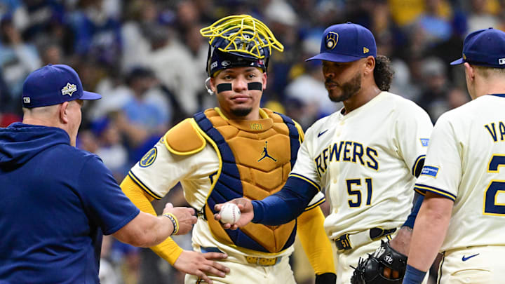 Oct 14, 2025; Milwaukee, Wisconsin, USA; Milwaukee Brewers pitcher Freddy Peralta (51) hands the ball to manager Pat Murphy (49) as he is relieved in the sixth inning during game two of the NLCS round against the Los Angeles Dodgers for the 2025 MLB playoffs at American Family Field. Mandatory Credit: Benny Sieu-Imagn Images Oct 14, 2025; Milwaukee, Wisconsin, USA; Milwaukee Brewers pitcher Freddy Peralta (51) hands the ball to manager Pat Murphy (49) as he is relieved in the sixth inning during game two of the NLCS round against the Los Angeles Dodgers for the 2025 MLB playoffs at American Family Field. Mandatory Credit: Benny Sieu-Imagn Images