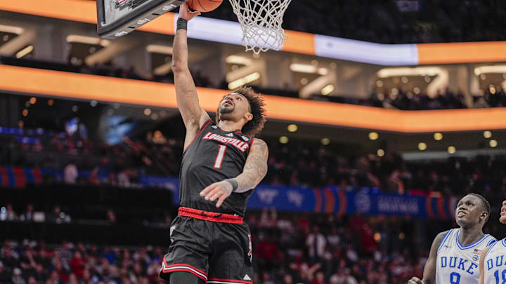 Mar 15, 2025; Charlotte, NC, USA; Louisville Cardinals guard J'Vonne Hadley (1) drives to the basket against the Duke Blue Devils during the 2025 ACC Conference Championship game at Spectrum Center. Mandatory Credit: Jim Dedmon-Imagn Images