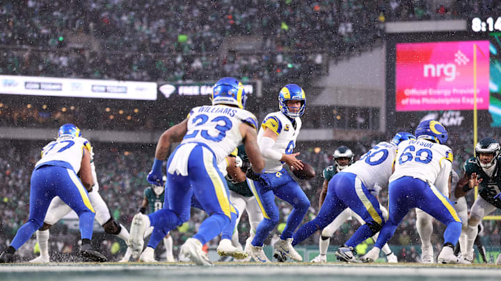 Jan 19, 2025; Philadelphia, Pennsylvania, USA; Los Angeles Rams quarterback Matthew Stafford (9) prepares to hand the ball to Los Angeles Rams running back Kyren Williams (23) against the Philadelphia Eagles during the first half in a 2025 NFC divisional round game at Lincoln Financial Field. Mandatory Credit: Bill Streicher-Imagn Images