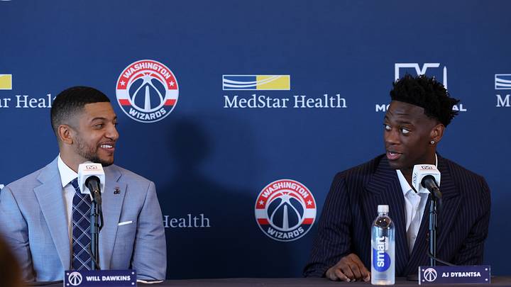 Jun 25, 2026; Washington, DC, USA; Washington Wizards first round draft pick and number one overall pick AJ Dybantsa (right) speaks to Wizards general manager Will Dawkins (left) during a press conference at InterContinental Hotel. Mandatory Credit: Amber Searls-Imagn Images