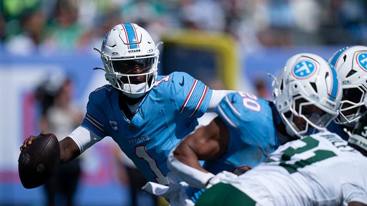 Tennessee quarterback Cam Ward (1) scrambles under New York’s pressure during their season opener at Nissan Stadium Sunday, Sept. 13, 2026. Tennessee quarterback Cam Ward (1) scrambles under New York’s pressure during their season opener at Nissan Stadium Sunday, Sept. 13, 2026.