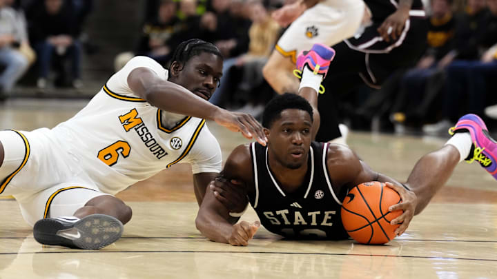 Missouri Tigers guard Annor Boateng (6) and Mississippi State Bulldogs guard Josh Hubbard (12) scramble for a loose ball during the first half of the game at Mizzou Arena.