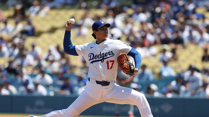 Aug 6, 2025; Los Angeles, California, USA;  Los Angeles Dodgers two-way player Shohei Ohtani (17) pitches in the first inning against the St. Louis Cardinals at Dodger Stadium. Mandatory Credit: Kiyoshi Mio-Imagn Images