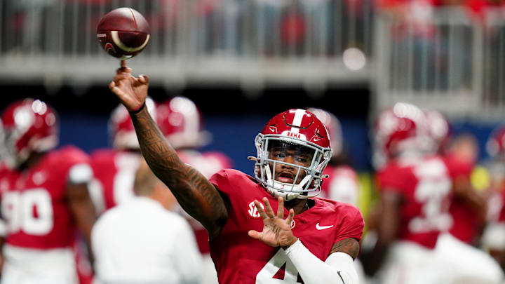 Dec 2, 2023; Atlanta, GA, USA; Alabama Crimson Tide quarterback Jalen Milroe (4) warms up before the SEC Championship against the Georgia Bulldogs at Mercedes-Benz Stadium. Mandatory Credit: John David Mercer-Imagn Images