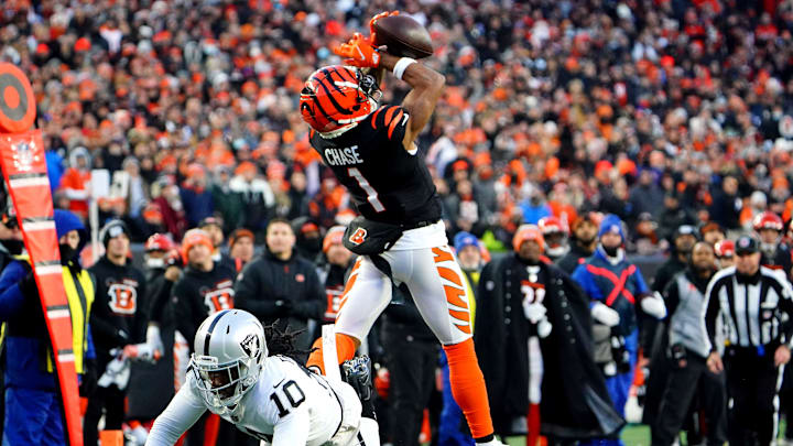 Cincinnati Bengals wide receiver Ja'Marr Chase (1) catches a pass as Las Vegas Raiders cornerback Desmond Trufant (10) defends in the second quarter during an NFL AFC wild-card playoff game, Saturday, Jan. 15, 2022, at Paul Brown Stadium in Cincinnati.
Las Vegas Raiders At Cincinnati Bengals Jan 15 Afc Wild Card Game Cincinnati Bengals wide receiver Ja'Marr Chase (1) catches a pass as Las Vegas Raiders cornerback Desmond Trufant (10) defends in the second quarter during an NFL AFC wild-card playoff game, Saturday, Jan. 15, 2022, at Paul Brown Stadium in Cincinnati.
Las Vegas Raiders At Cincinnati Bengals Jan 15 Afc Wild Card Game