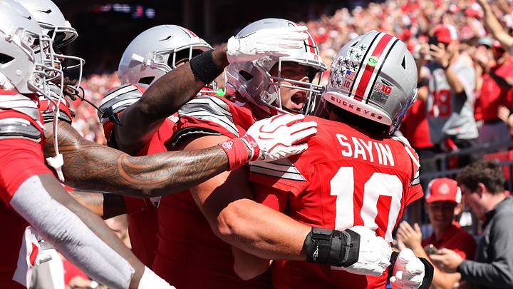 Sep 26, 2026; Columbus, Ohio, USA;  Ohio State Buckeyes quarterback Julian Sayin (10) celebrates with teammates during the second half against the Illinois Fighting Illini at Ohio Stadium.  Mandatory Credit: Joseph Maiorana-Imagn Images