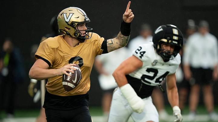 Vanderbilt quarterback Jared Curtis (2) directs his receivers while pressured by Vanderbilt linebacker Nick Rinaldi (24) during Vanderbilt Football's Black and Gold Spring Game in FirstBank Stadium at Vanderbilt University Saturday, April 18, 2026. Vanderbilt quarterback Jared Curtis (2) directs his receivers while pressured by Vanderbilt linebacker Nick Rinaldi (24) during Vanderbilt Football's Black and Gold Spring Game in FirstBank Stadium at Vanderbilt University Saturday, April 18, 2026.