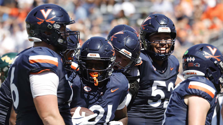 Sep 13, 2025; Charlottesville, Virginia, USA; Virginia Cavaliers running back Harrison Waylee (21) celebrates with teammates after scoring a touchdown against the William & Mary Tribe during the second quarter at Scott Stadium. Mandatory Credit: Amber Searls-Imagn Images Sep 13, 2025; Charlottesville, Virginia, USA; Virginia Cavaliers running back Harrison Waylee (21) celebrates with teammates after scoring a touchdown against the William & Mary Tribe during the second quarter at Scott Stadium. Mandatory Credit: Amber Searls-Imagn Images