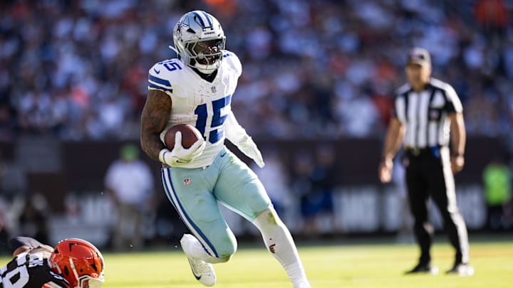 Sep 8, 2024; Cleveland, Ohio, USA; Dallas Cowboys running back Ezekiel Elliott (15) runs the ball against the Cleveland Browns during the second quarter at Huntington Bank Field.