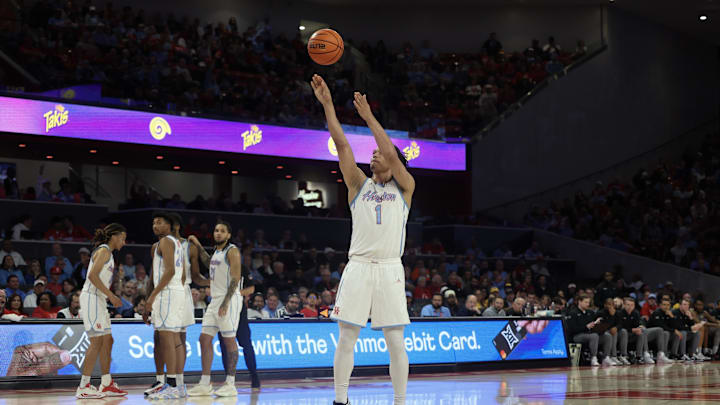 Jan 13, 2026; Houston, Texas, USA; Houston Cougars guard Isiah Harwell (1) shoots a technical foul shot against the West Virginia Mountaineers  in the second half at Fertitta Center. Mandatory Credit: Thomas Shea-Imagn Images