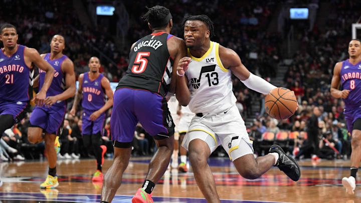 Mar 7, 2025; Toronto, Ontario, CAN;  Utah Jaz guard Isaiah Collier (13) drives to the basket as Toronto Raptors guard Immanuel Quickley (5) defends in the second half at Scotiabank Arena. Mandatory Credit: Dan Hamilton-Imagn Images