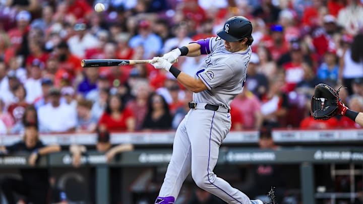 Jul 11, 2025; Cincinnati, Ohio, USA; Colorado Rockies first baseman Michael Toglia (4) bats against the Cincinnati Reds in the second inning at Great American Ball Park. Mandatory Credit: Katie Stratman-Imagn Images