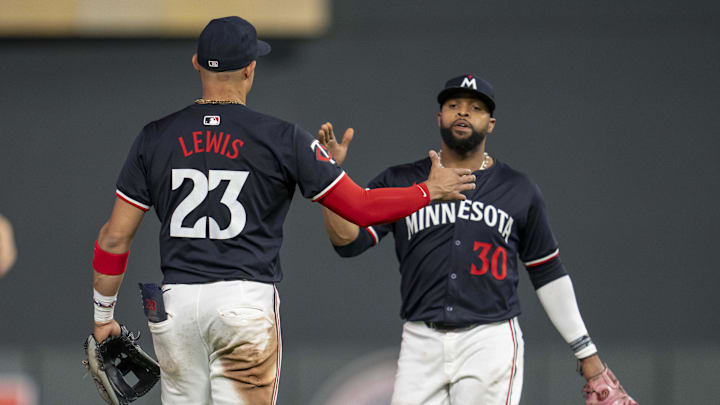 Sep 25, 2024; Minneapolis, Minnesota, USA; Minnesota Twins third baseman Royce Lewis (23) and first baseman Carlos Santana (30) after defeating the Miami Marlins at Target Field. Mandatory Credit: Jesse Johnson-Imagn Images