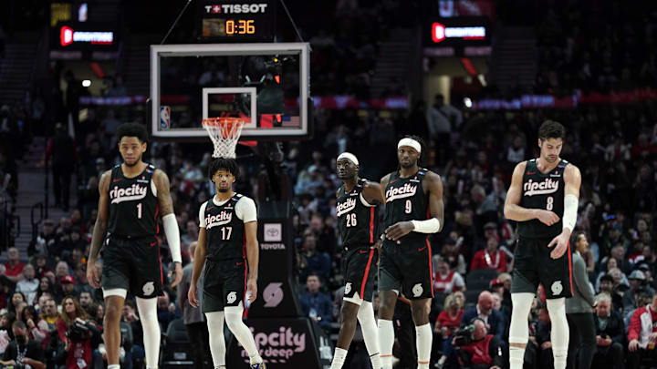 Dec 6, 2024; Portland, Oregon, USA; Portland Trail Blazers (from left to right) Anfernee Simons (1), Shaedon Sharpe (17), Duop Reath (26), Jerami Grant (9), and Deni Avdija (8) walk back to the court after a timeout during the first half against the Utah Jazz at Moda Center. Mandatory Credit: Soobum Im-Imagn Images Dec 6, 2024; Portland, Oregon, USA; Portland Trail Blazers (from left to right) Anfernee Simons (1), Shaedon Sharpe (17), Duop Reath (26), Jerami Grant (9), and Deni Avdija (8) walk back to the court after a timeout during the first half against the Utah Jazz at Moda Center. Mandatory Credit: Soobum Im-Imagn Images