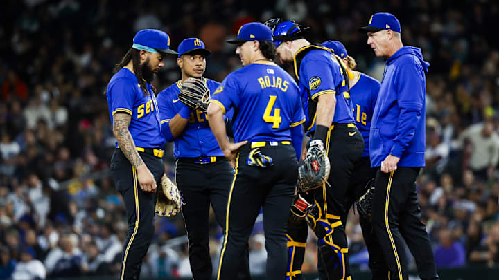 Seattle Mariners manager Dan Wilson (6, right) stands on the mound with shortstop J.P. Crawford (3, left), second baseman Jorge Polanco (7, second from left), third baseman Josh Rojas (4, third from left) and catcher Cal Raleigh (29, third from right) during a fifth inning pitching change against the New York Yankees at T-Mobile Park on Sept 17.