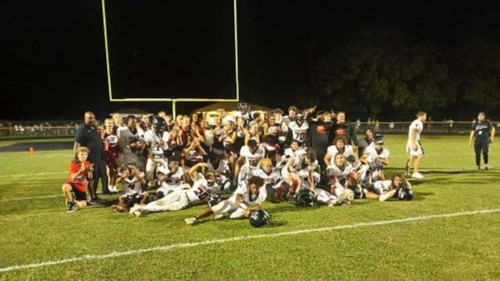 Dunedin High School's football team celebrating win over Countryside in Week 1