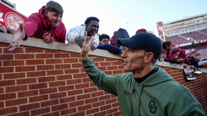 Oklahoma coach Brent Venables celebrates with Sooner Nation after beating Missouri.