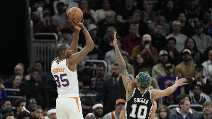 Feb 20, 2025; Austin, Texas, USA; Phoenix Suns forward Kevin Durant (35) shoots over San Antonio Spurs forward Jeremy Sochan (10) during the second half at Moody Center. Mandatory Credit: Scott Wachter-Imagn Images