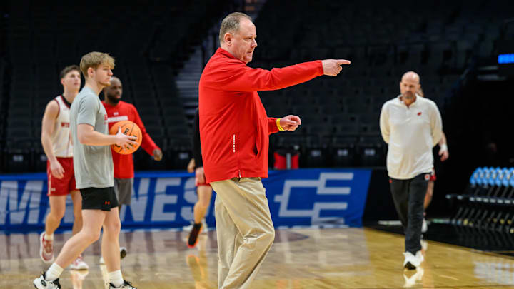 Mar 18, 2026; Portland, OR, USA; Wisconsin Badgers head coach Greg Gard directs his team during a practice session ahead of the first round of the men's 2026 NCAA Tournament at Moda Center. Mandatory Credit: Craig Strobeck-Imagn Images