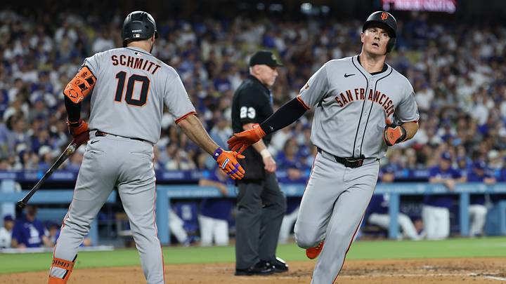 Los Angeles, California, USA; San Francisco Giants third baseman Matt Chapman (26) celebrates with third baseman Casey Schmitt (10) after scoring during the third inning against the Los Angeles Dodgers at Dodger Stadium. Mandatory Credit: Kiyoshi Mio-Imagn Images