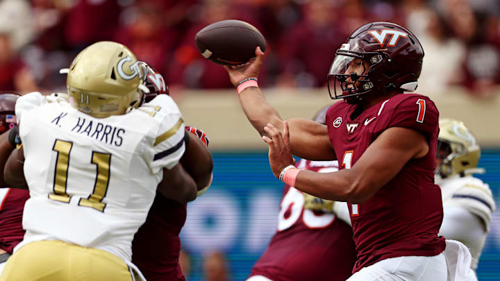 Oct 26, 2024; Blacksburg, Virginia, USA; Virginia Tech Hokies quarterback Kyron Drones (1) throws a pass during the first quarter against the Georgia Tech Yellow Jackets at Lane Stadium. Mandatory Credit: Peter Casey-Imagn Images
