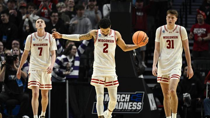 Mar 19, 2026; Portland, OR, USA; Wisconsin Badgers guard Andrew Rohde (7), guard Nick Boyd (2), and forward Nolan Winter (31) react during the second half of a first round game of the men's 2026 NCAA Tournament against the High Point Panthers at Moda Center. Mandatory Credit: Troy Wayrynen-Imagn Images Mar 19, 2026; Portland, OR, USA; Wisconsin Badgers guard Andrew Rohde (7), guard Nick Boyd (2), and forward Nolan Winter (31) react during the second half of a first round game of the men's 2026 NCAA Tournament against the High Point Panthers at Moda Center. Mandatory Credit: Troy Wayrynen-Imagn Images