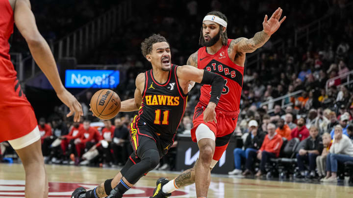 Feb 23, 2024; Atlanta, Georgia, USA; Atlanta Hawks guard Trae Young (11) dribbles guarded by Toronto Raptors guard Gary Trent Jr. (33) during the first half at State Farm Arena. Mandatory Credit: Dale Zanine-USA TODAY Sports Feb 23, 2024; Atlanta, Georgia, USA; Atlanta Hawks guard Trae Young (11) dribbles guarded by Toronto Raptors guard Gary Trent Jr. (33) during the first half at State Farm Arena. Mandatory Credit: Dale Zanine-USA TODAY Sports