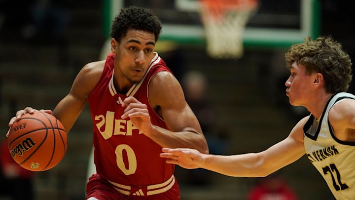Jeffersonville Red Devils forward Tre Singleton (0) rushes up the court against Mt. Vernon Marauders Tanner Teschendorf (22) on Saturday, March 22, 2025, during the game at New Castle Fieldhouse in New Castle. The Jeffersonville Red Devils defeated the Mt. Vernon Marauders, 63-59..