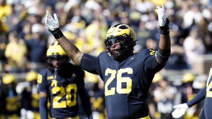 Oct 18, 2025; Ann Arbor, Michigan, USA;  Michigan Wolverines defensive lineman Rayshaun Benny (26) fires up the crowd in the first half against the Michigan Wolverines at Michigan Stadium. Mandatory Credit: Rick Osentoski-Imagn Images