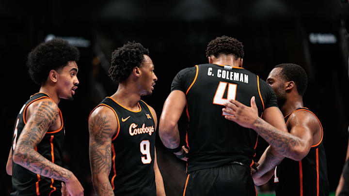 Mar 10, 2026; Kansas City, MO, USA; Oklahoma State Cowboys huddle during a break in play in the second half of the game against the Colorado Buffaloes at T-Mobile Center. Mandatory Credit: William Purnell-Imagn Images