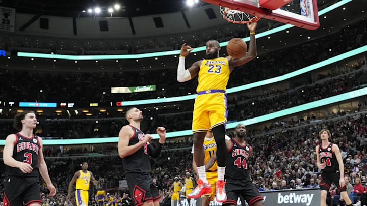 Mar 27, 2025; Chicago, Illinois, USA; Los Angeles Lakers forward LeBron James (23) dunks on Chicago Bulls forward Patrick Williams (44) during the second half at United Center. Mandatory Credit: David Banks-Imagn Images Mar 27, 2025; Chicago, Illinois, USA; Los Angeles Lakers forward LeBron James (23) dunks on Chicago Bulls forward Patrick Williams (44) during the second half at United Center. Mandatory Credit: David Banks-Imagn Images