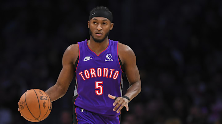 Nov 10, 2024; Los Angeles, California, USA; Toronto Raptors guard Immanuel Quickley (5) dribbles the ball against the Los Angeles Lakers during the second half at Crypto.com Arena. Mandatory Credit: Jonathan Hui-Imagn Images