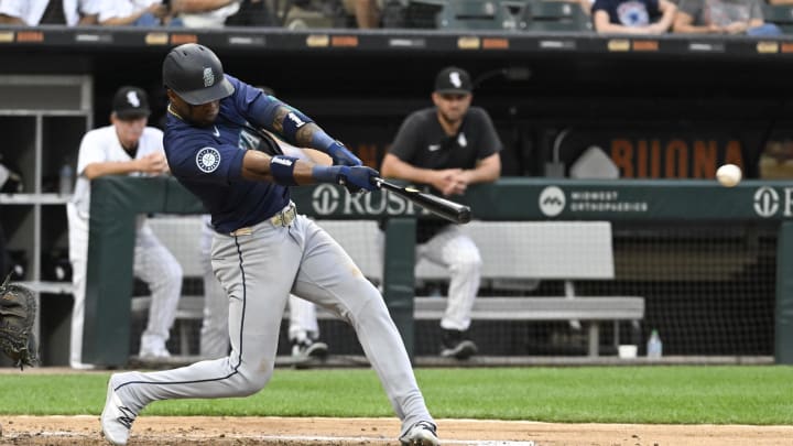 Seattle Mariners outfielder Victor Robles (10) hits an RBI single against the Chicago White Sox during the fourth inning at Guaranteed Rate Field on July 27. Seattle Mariners outfielder Victor Robles (10) hits an RBI single against the Chicago White Sox during the fourth inning at Guaranteed Rate Field on July 27.