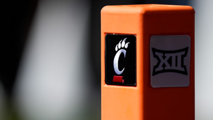 An end zone pylon bears the Cincinnati Bearcats and Big 12 conference logos in the first quarter of the NCAA Big 12 football game between the Cincinnati Bearcats and the Oklahoma Sooners at Nippert Stadium in Cincinnati on Saturday, Sept. 23, 2023. An end zone pylon bears the Cincinnati Bearcats and Big 12 conference logos in the first quarter of the NCAA Big 12 football game between the Cincinnati Bearcats and the Oklahoma Sooners at Nippert Stadium in Cincinnati on Saturday, Sept. 23, 2023.